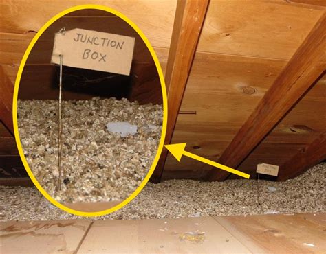 dark colored insulation around electrical boxes in attic|attic junction cover insulation.